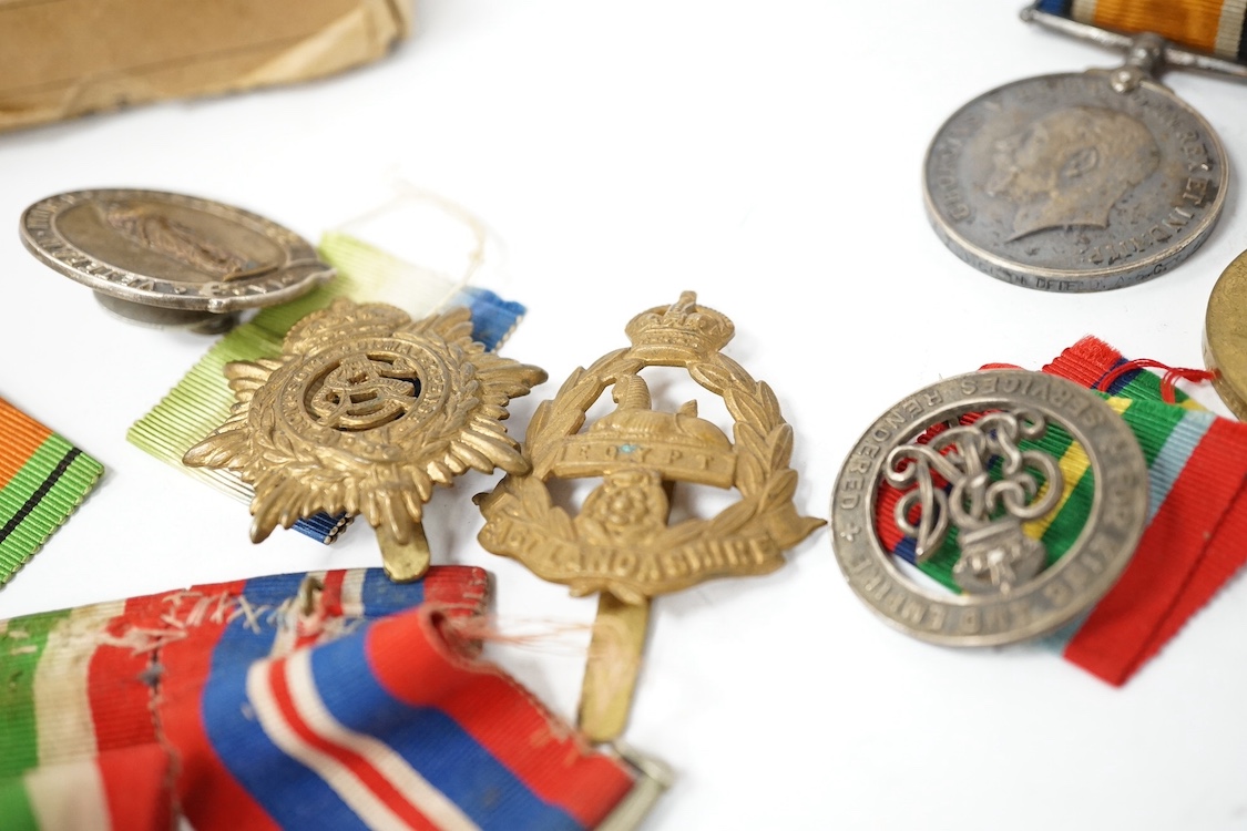 Nine military medals including; a First World War medal pair to T3-026887 DVR. C. Oldfield. A.S.C., a WWII group comprising; The Atlantic Star, The 1939-1945 Star, The Italy Star and The 1939-1945 Medal with a clasp for